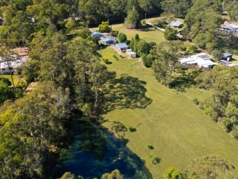 Picturesque Acreage with Dam & Cottages