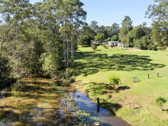 Picturesque Acreage with Dam & Cottages